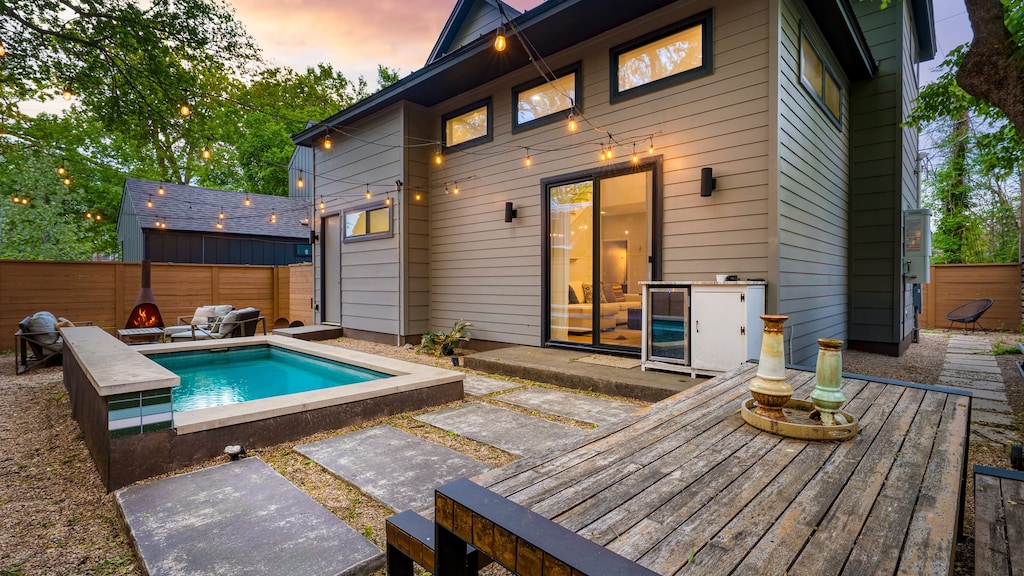 Outdoor space featuring a private pool, seating area, and cozy firepit—perfect for relaxing days and evenings under the stars.