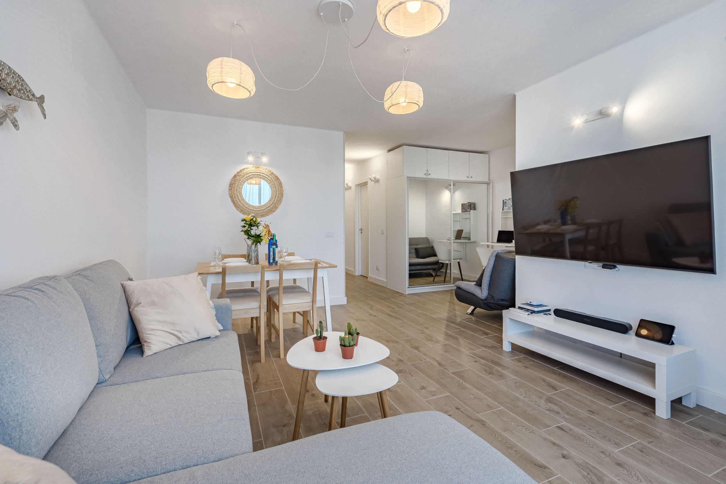 Living Room with Sofa Bed, TV, Air Conditioner, Sound System, iPad and Dining Table Living Room with Sofa Bed, TV, Air Conditioner, Sound System, iPad and Dining Table