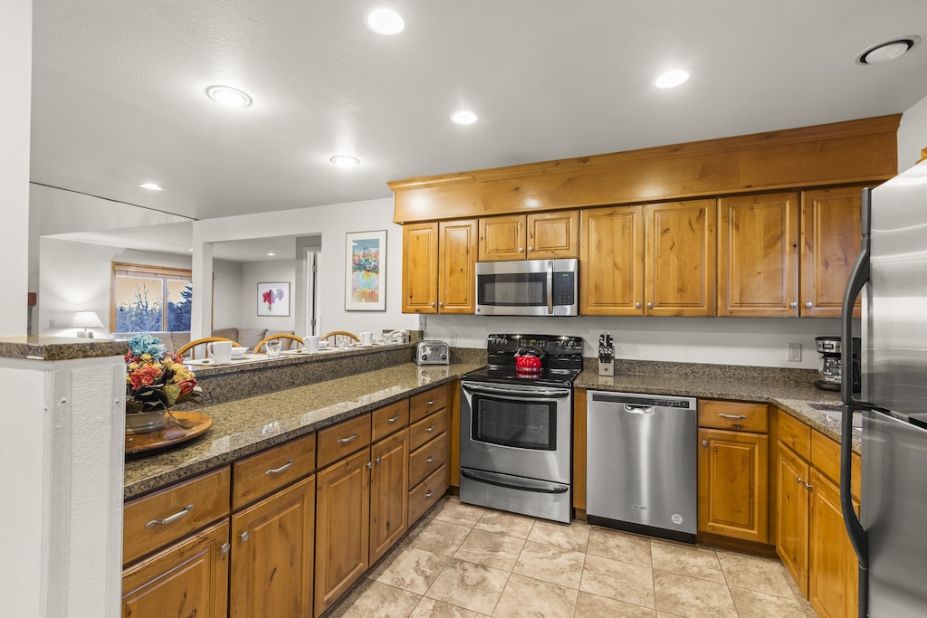 Snowflower 41 has a well-equipped kitchen with wooden cabinets and