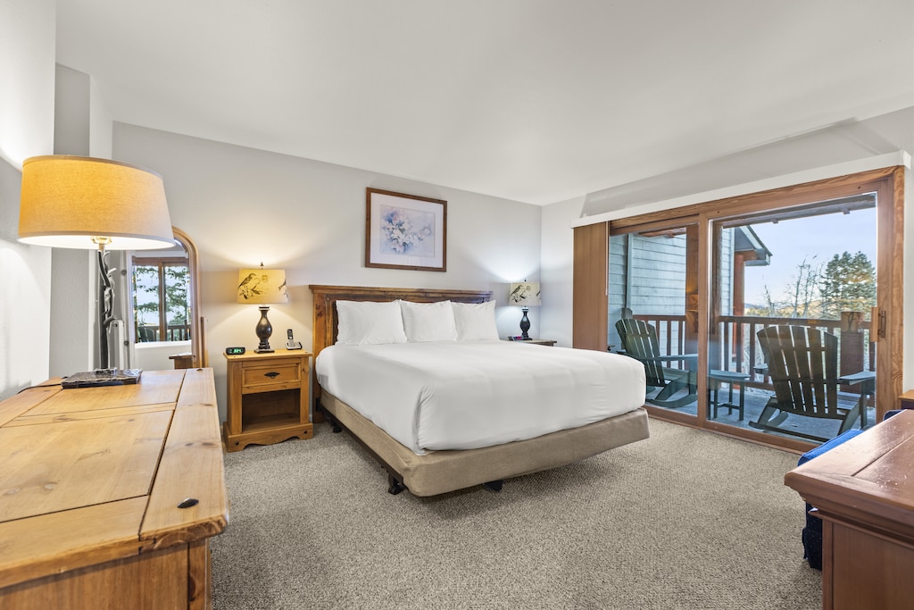 The main suite with a king-size bed and wood headboard.
