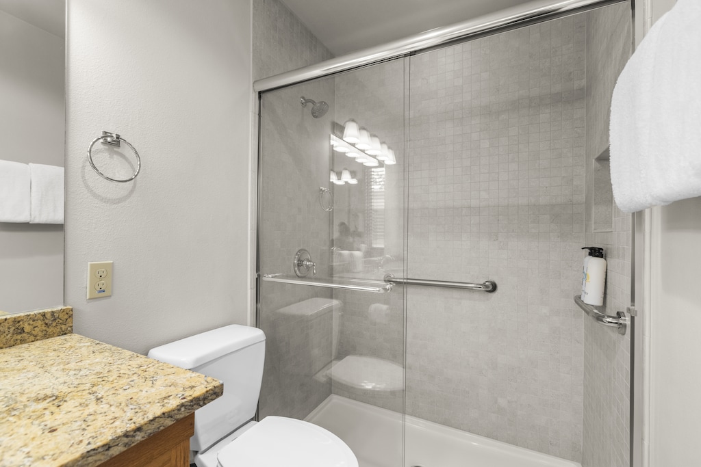 A bathroom with a bathtub and shower combination.