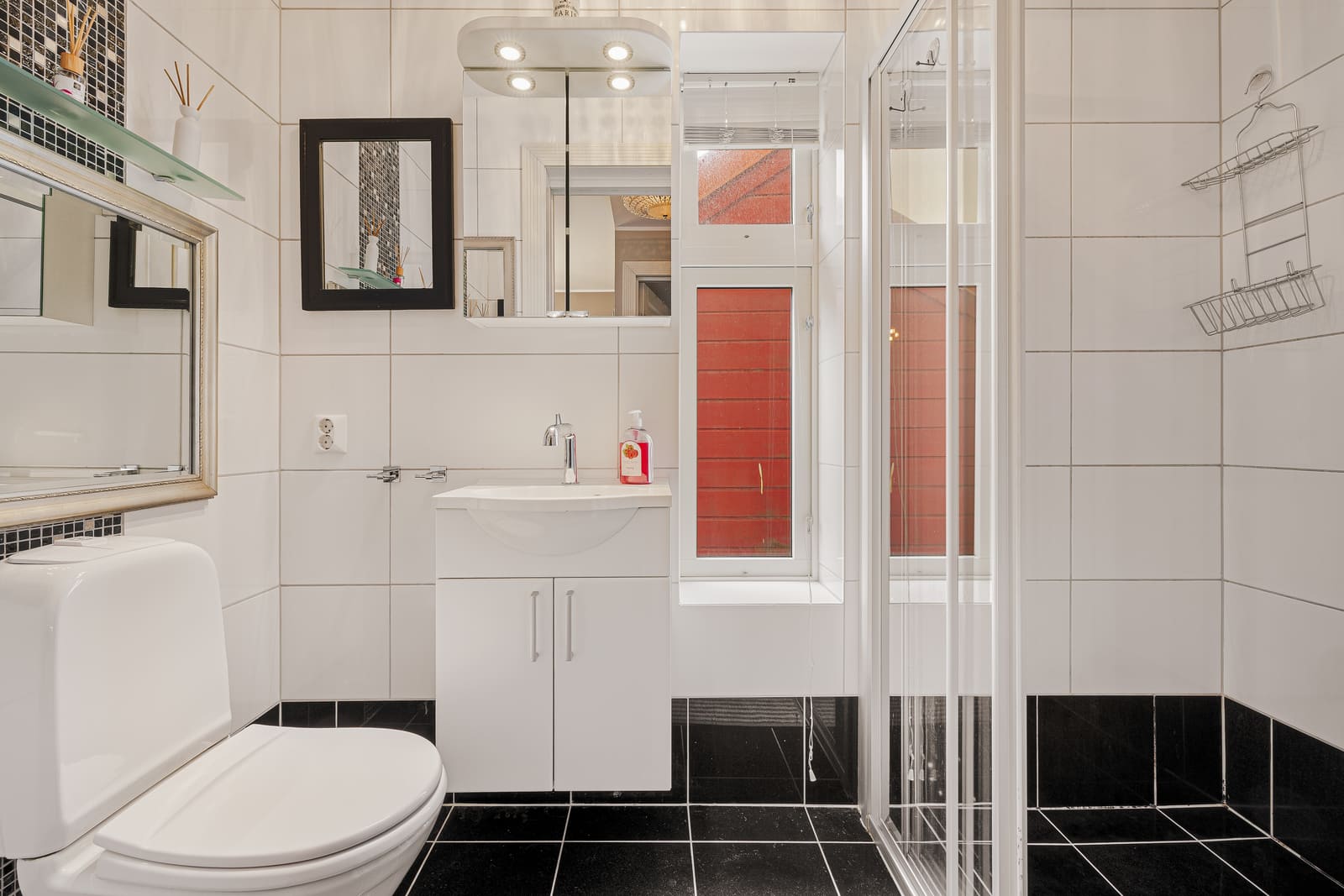 The bathroom's layout is well-organized, maximizing space efficiently.