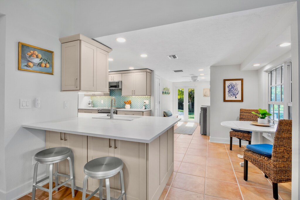 Stylish island with barstools