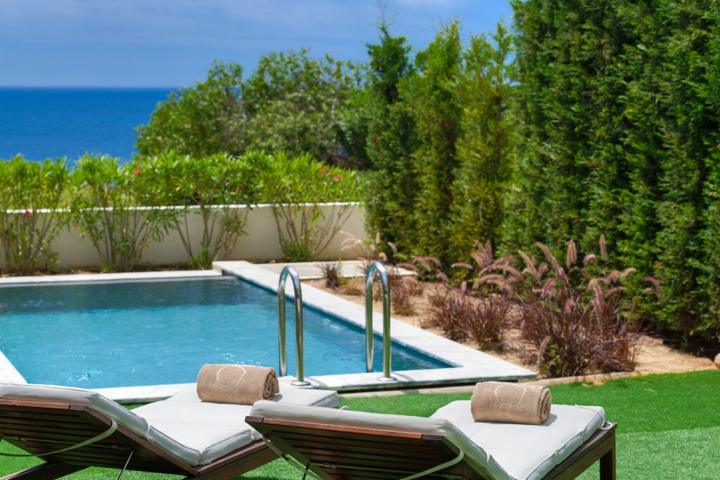 Poolside with comfortable sunbeds