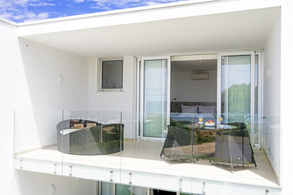 Balcony with patio set and elevated views
