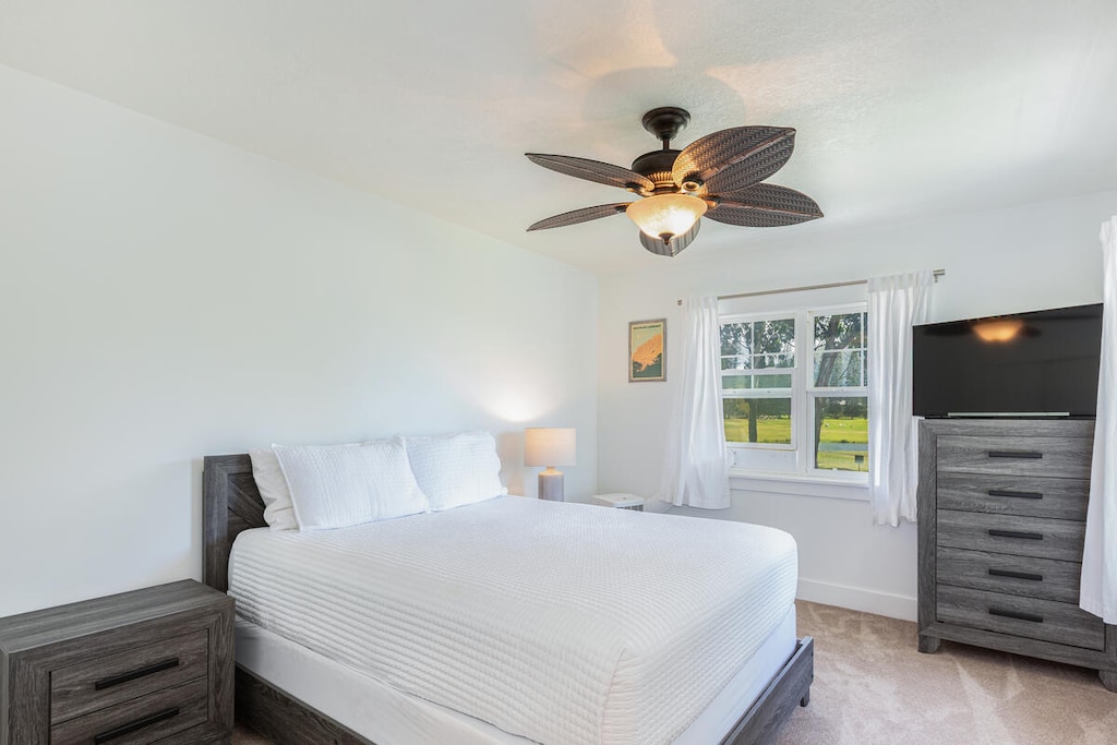 Second bedroom with a queen-size bed and elegant design.