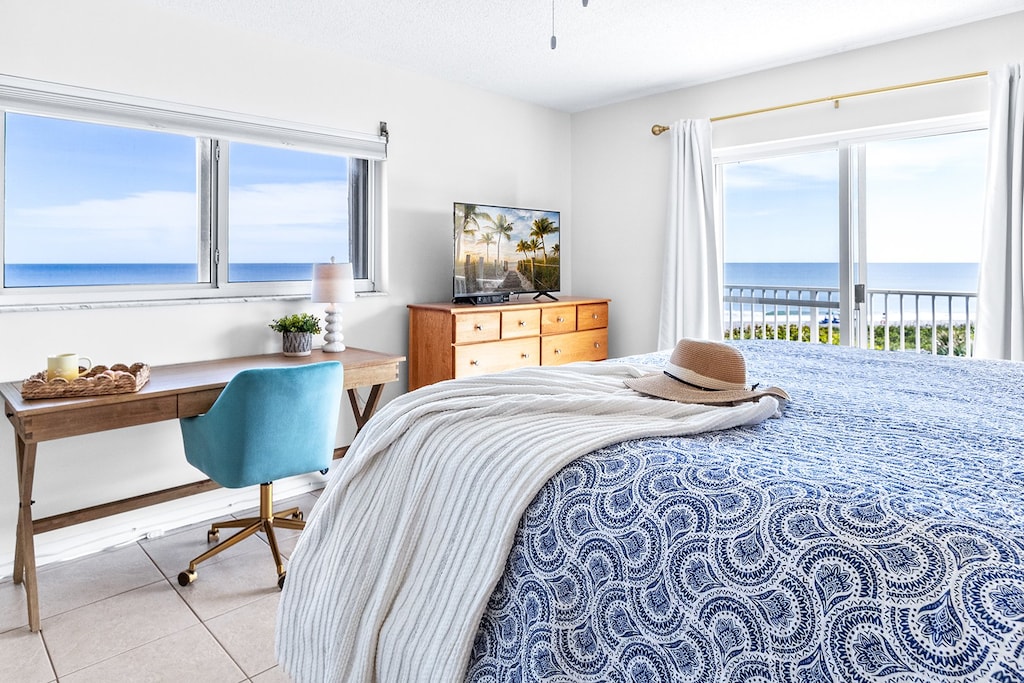 Incredible Master Bedroom with VIEWS, King bed, desk and TV. Walk out onto your private balcony
