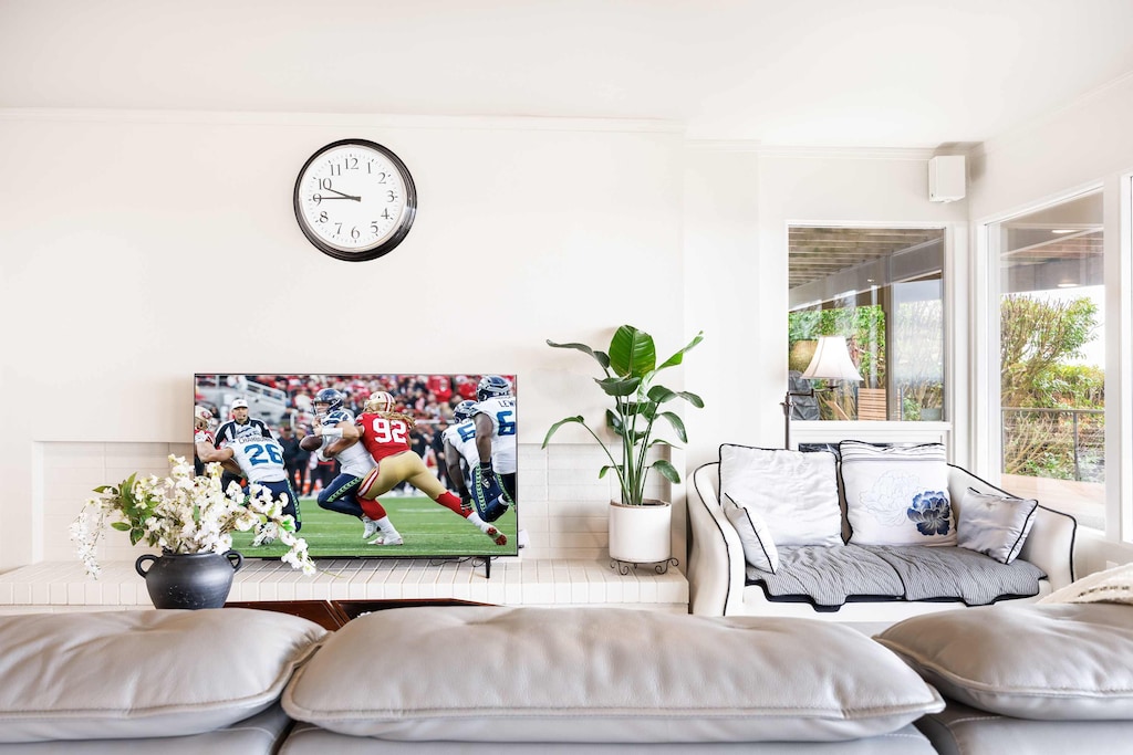 The living room is bright with natural light