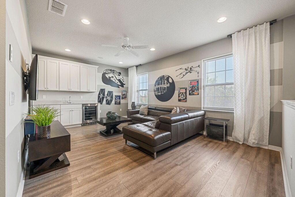 Loft area with a large Smart Tv and seating area