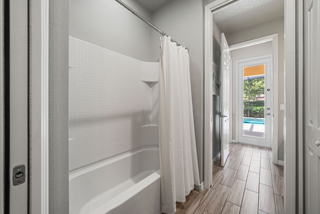 Bathroom 2 with a bathtub and shower combo