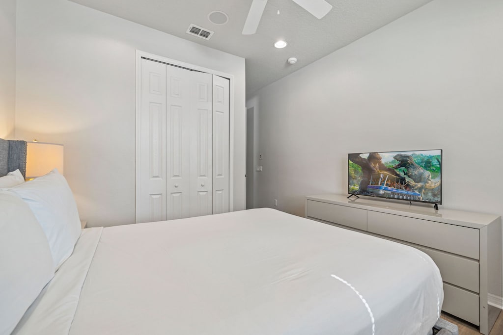 Bedroom 2 with a queen size bed and a private bathroom