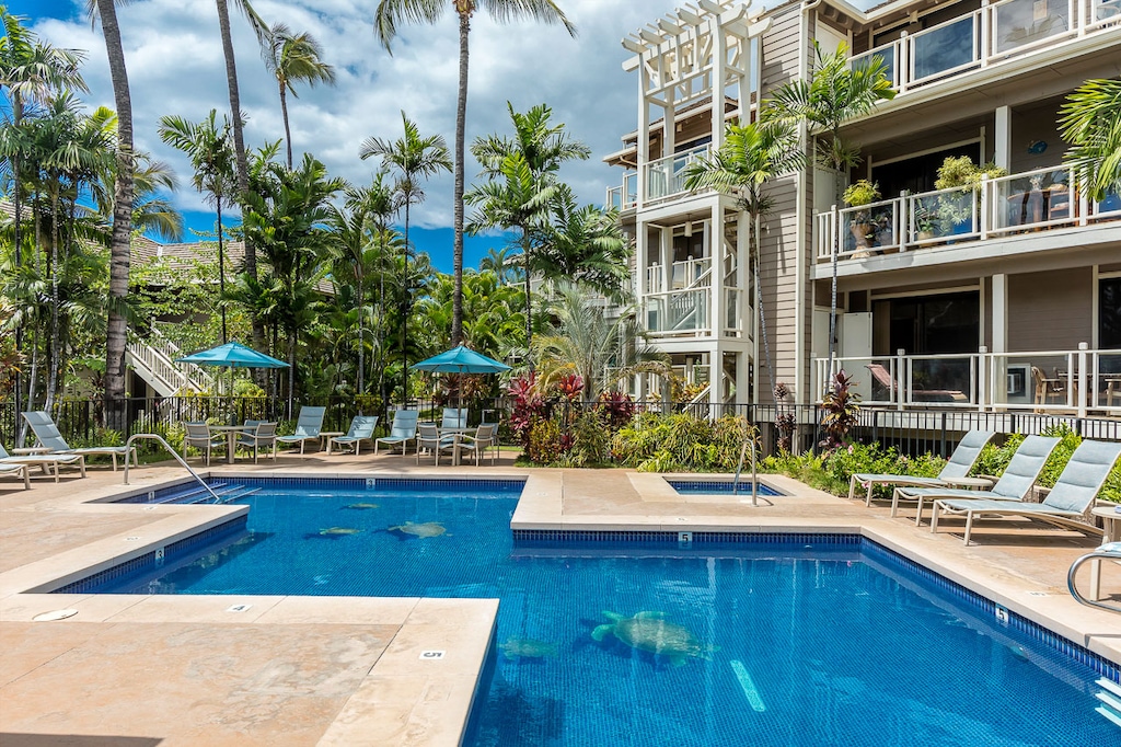 Calm waters framed by tropical landscaping