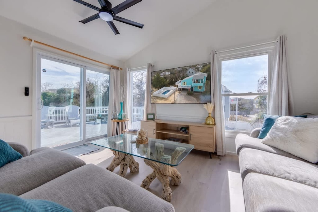Unwind in style in our sun-kissed living room oasis ☀️. Bask in abundant natural light as you sink into plush seating, perfect for cozy movie nights or lively game sessions. Step outside onto the deck for a soothing soak in the hot tub or enjoy alfr
