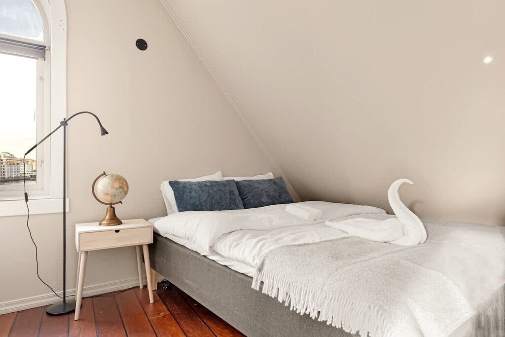 Experience a restful night's sleep in our comfortable bedrooms with ample wardrobe space, setting the stage for an energized day of exploration in Bergen!