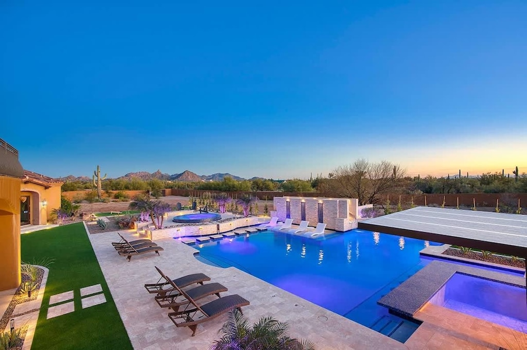Twilight transforms the pool into a glowing desert jewel