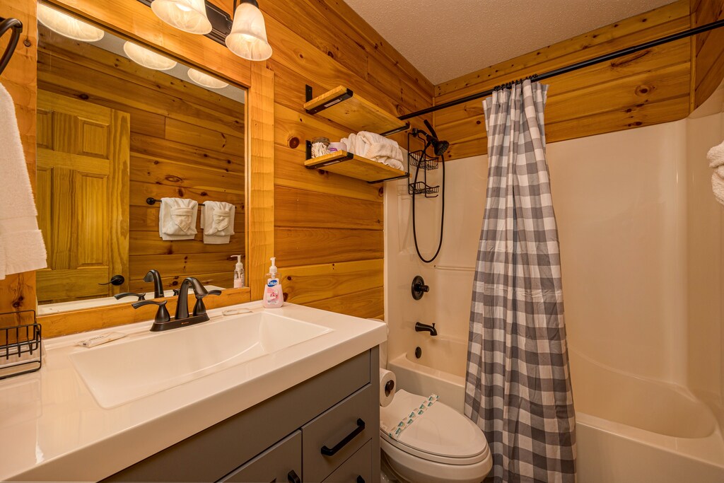 Single vanity sink with bathtub