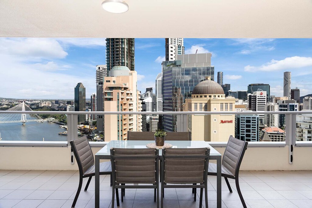 The spacious balcony with spectacular views of the story bridge, Brisbane river, and city