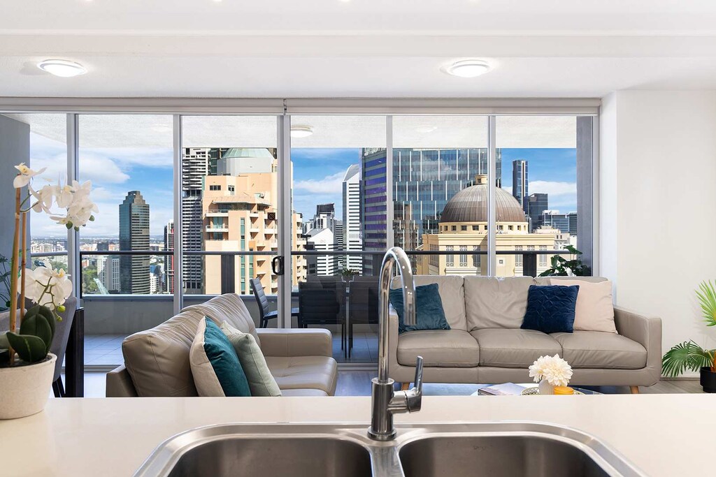 Spacious kitchen and living area looking out towards some of the best views of Brisbane city & river