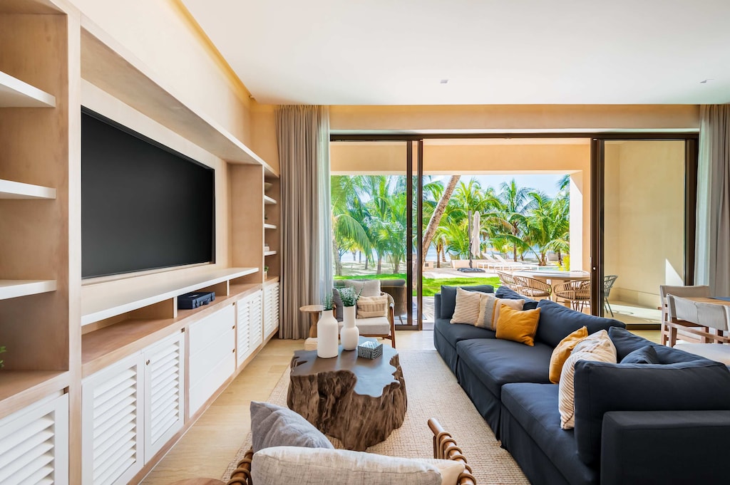 Living room with TV and patio access