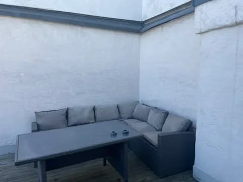 Modern outdoor furniture arrangement on the property's deck.
