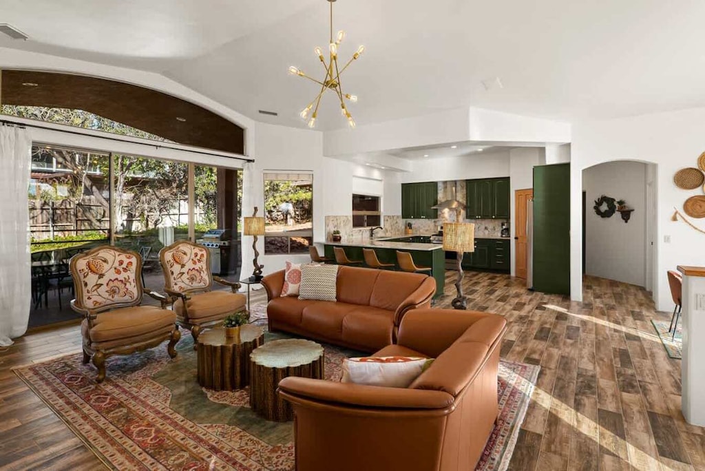 Spacious, open living area connects to the kitchen and patio views.