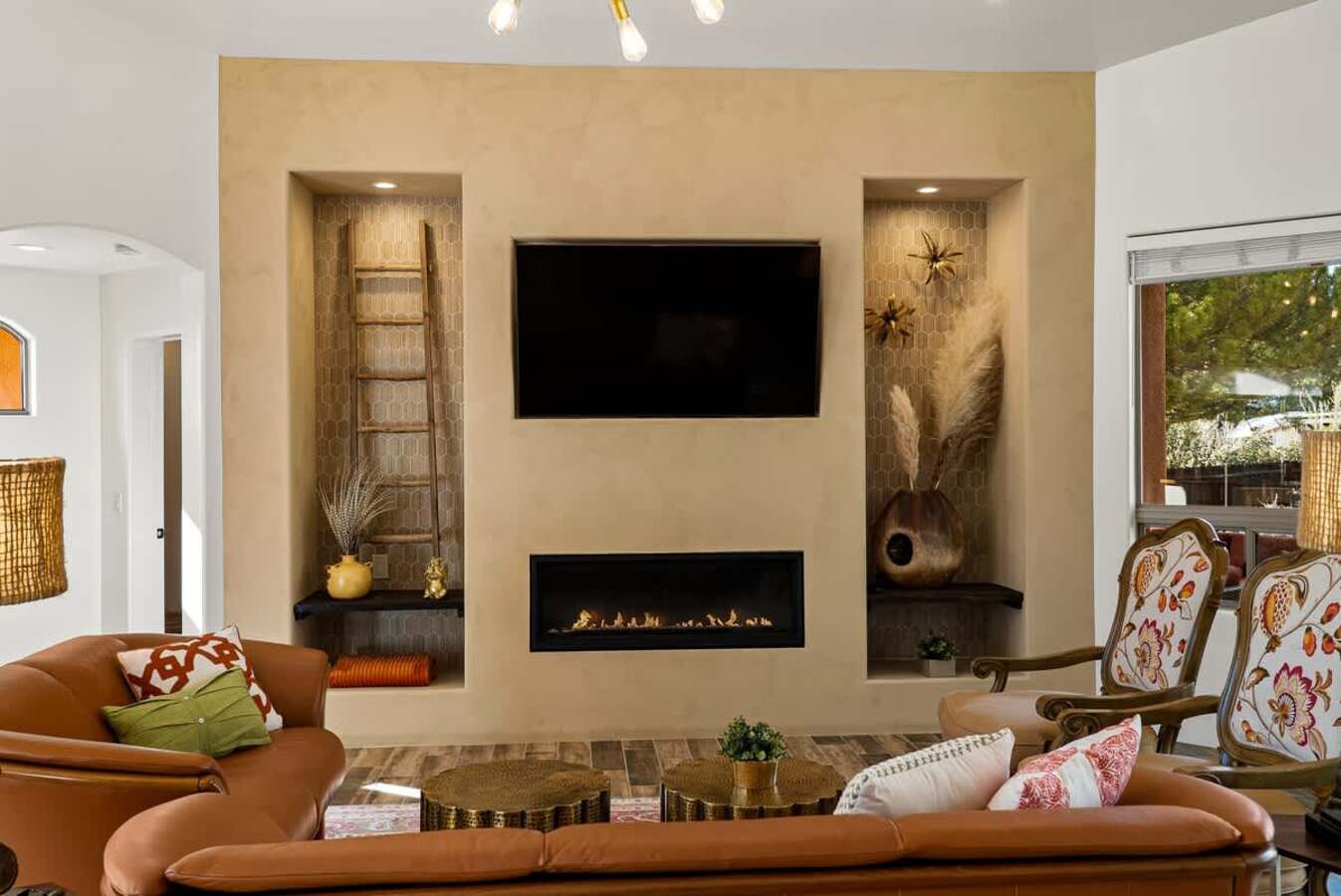 Gather around the fireplace in the cozy living room.