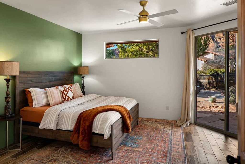 Relax in this inviting bedroom with a king-sized bed and soothing green accents.