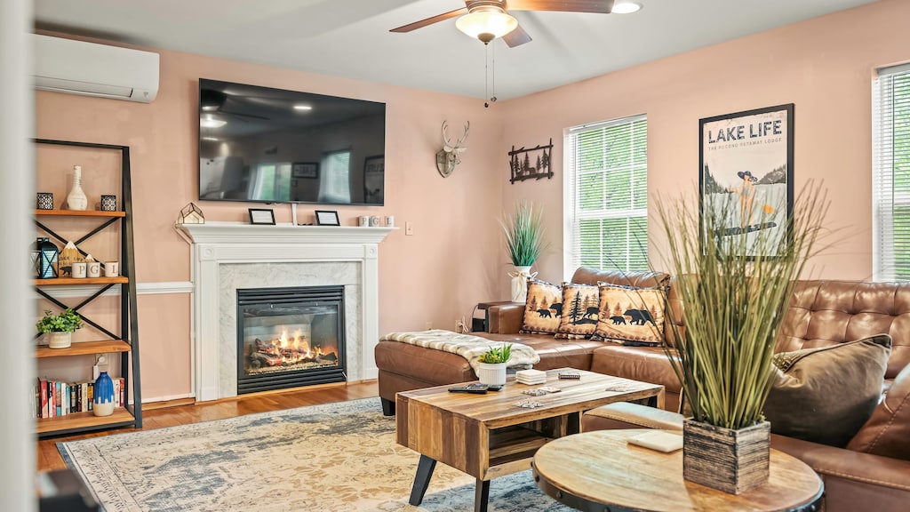 Inviting living room with fireplace, mounted TV, and stylish decor.