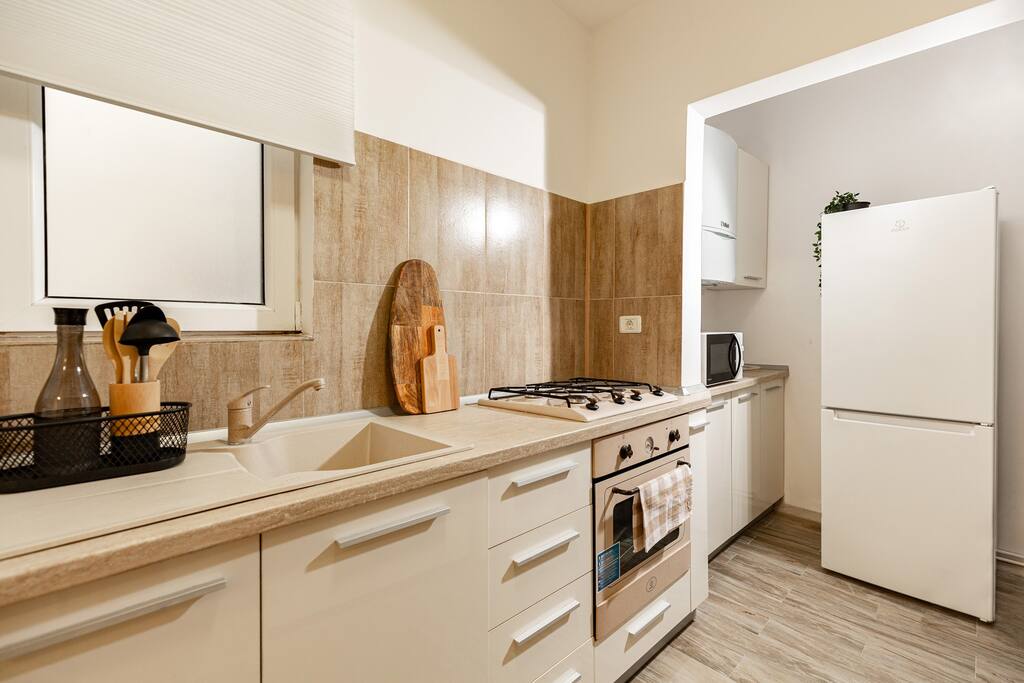 Experience the intersection of luxury and functionality in our gourmet kitchen, where sleek design meets high-end appliances for an unparalleled culinary experience.