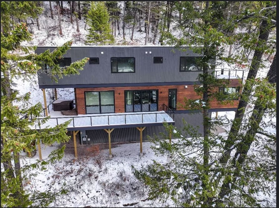 Tucked into the woods alongside Whitefish Lake, the Timber Haus offers a secluded feeling while still being close to the areas attractions | Exterior
