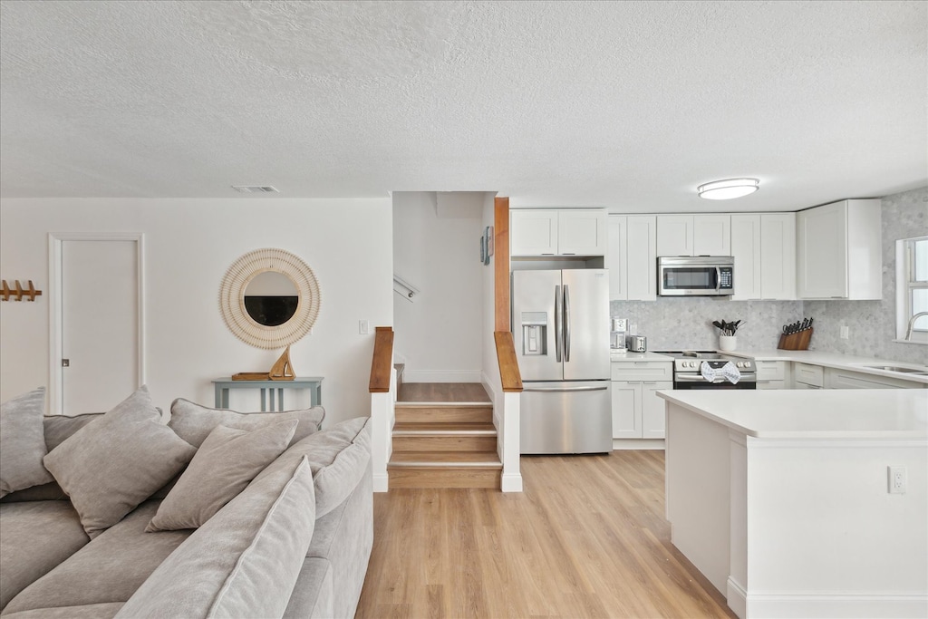 Kitchen area view with living area view