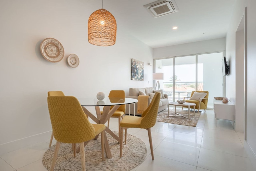 Gather around the stylish dining table, where every meal feels like an experience - Relax in the open living space, filled with natural light and inviting decor - Step onto your private balcony to enjoy the fresh breeze and a peaceful escape