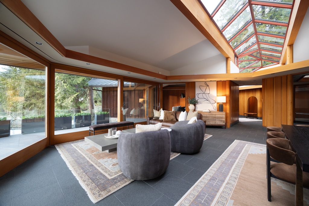 Inviting open-concept living space with a stunning glass ceiling.