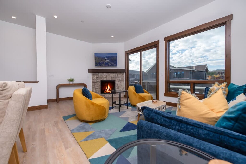 Cozy up by the fireplace after a day of adventure. Our bright and stylish living room is the perfect spot to relax and unwind with friends and family.

