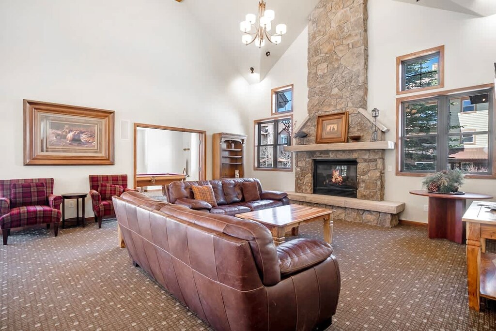 - Gather ‘round the grand stone fireplace for cozy evenings or game day fun
- Sink into rich leather sofas under soaring ceilings and mountain lodge charm
- Warm, rustic space perfect for unwinding or connecting with fellow travelers