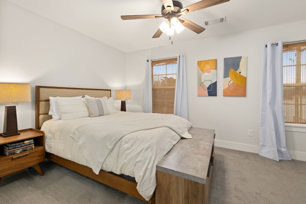 Our second bedroom is complete with a Queen-size bed, closet, Smart TV, and a nearby bathroom.