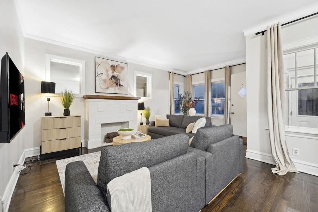 Plush seating, large Smart TV, and natural light make this living room the heart of the home.