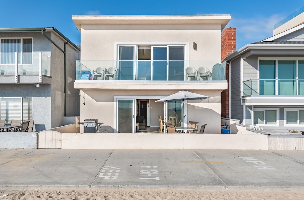 This oceanfront home is located on the first floor of the property, with a great front patio that is perfect for grilling, sunning, and people-watching!