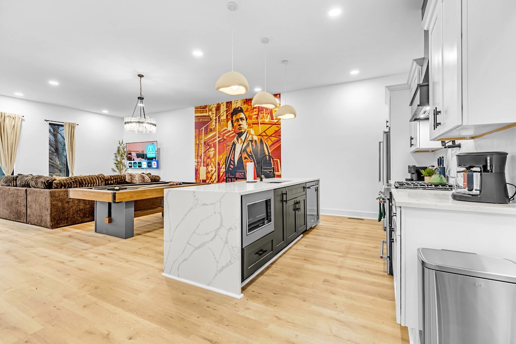 Enjoy a stylish oasis in this spacious vacation rental with a chic game room, perfect for unwinding after a night in Downtown Nashville. Ideal for bachelorette parties or family reunions, it offers elegant decor, cozy comforts, and city views for unforgettable memories!