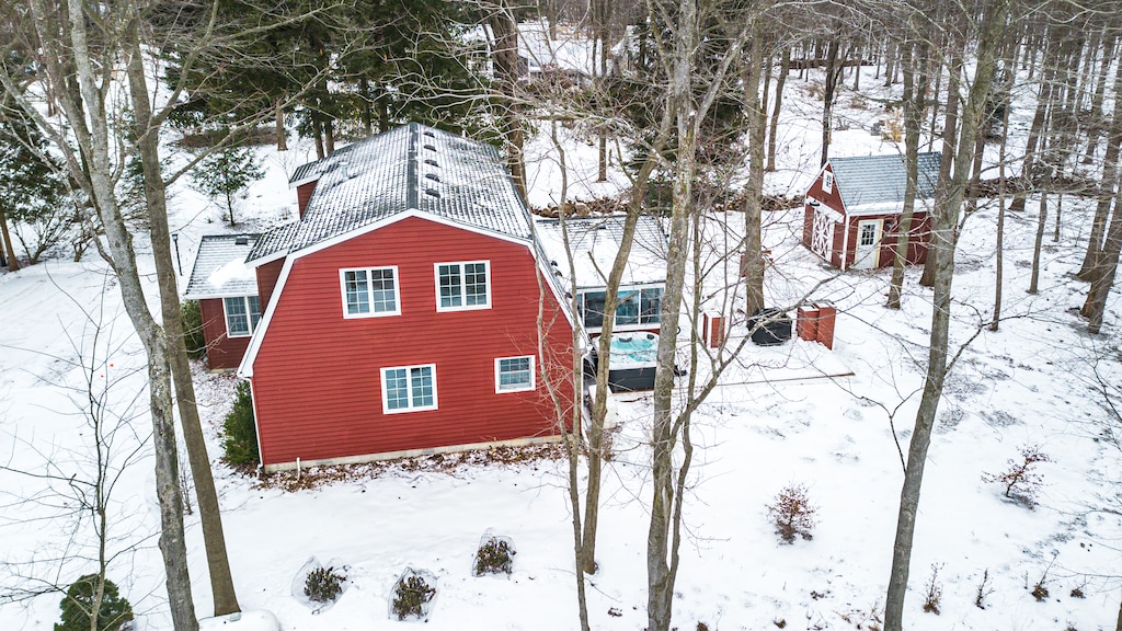 A storybook retreat surrounded by snowy woodland beauty.