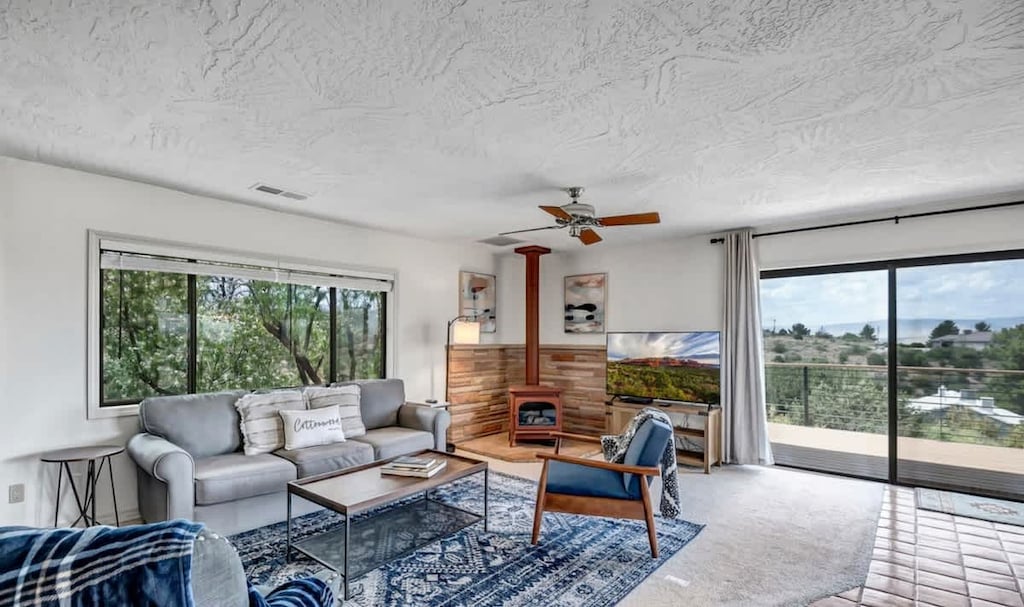 Relax and unwind in this spacious living area. Fireplace included!