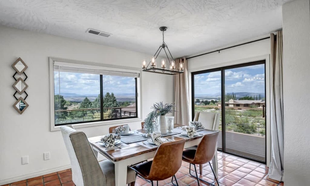 Gather for meals with loved ones in this sunlit dining room.