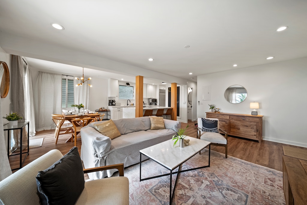 Living area featuring a comfortable leather sofa and a large coffee table.