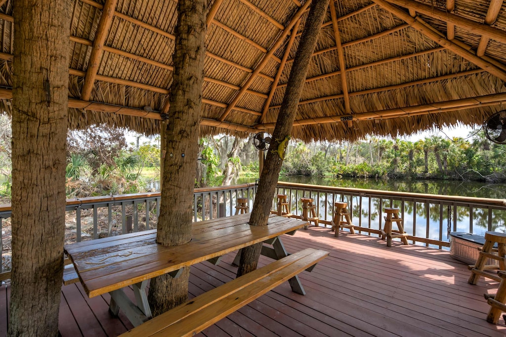 Gather under the tiki hut for a meal or drinks, surrounded by tranquil water views and the sounds of nature.