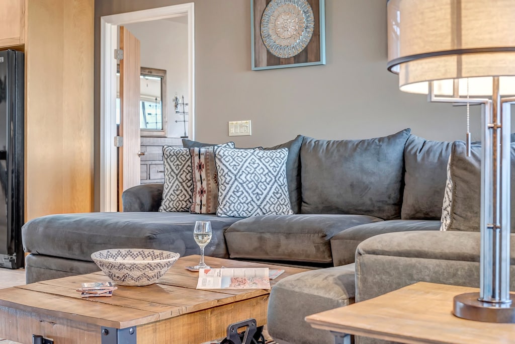 Comfortable sectional sofa and 65” Smart TV, with board
games for entertainment