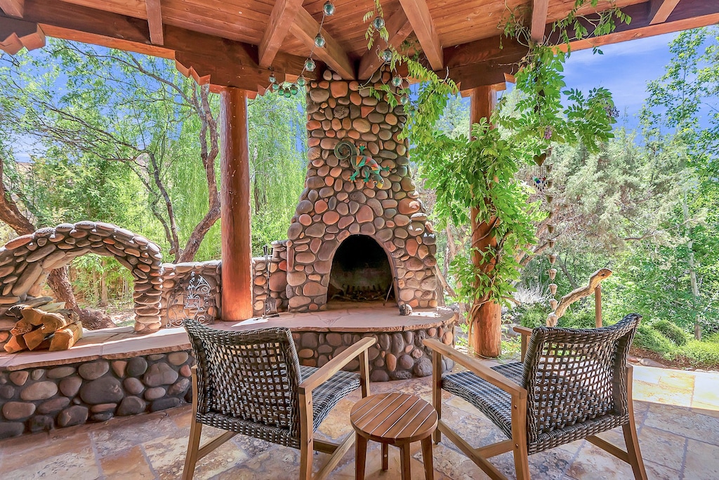 Enjoy the Beautiful Outdoor Landscape next to Stone Fireplace