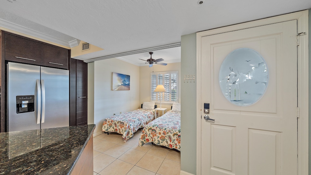 Conveniently located near the kitchen, the private sleeping nook features two twin beds and is perfect for children, offering a quiet retreat in this well-appointed Sarasota rental.