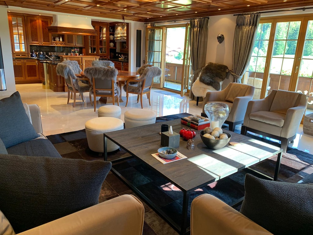 An overview of the living room, dining area, and open kitchen.