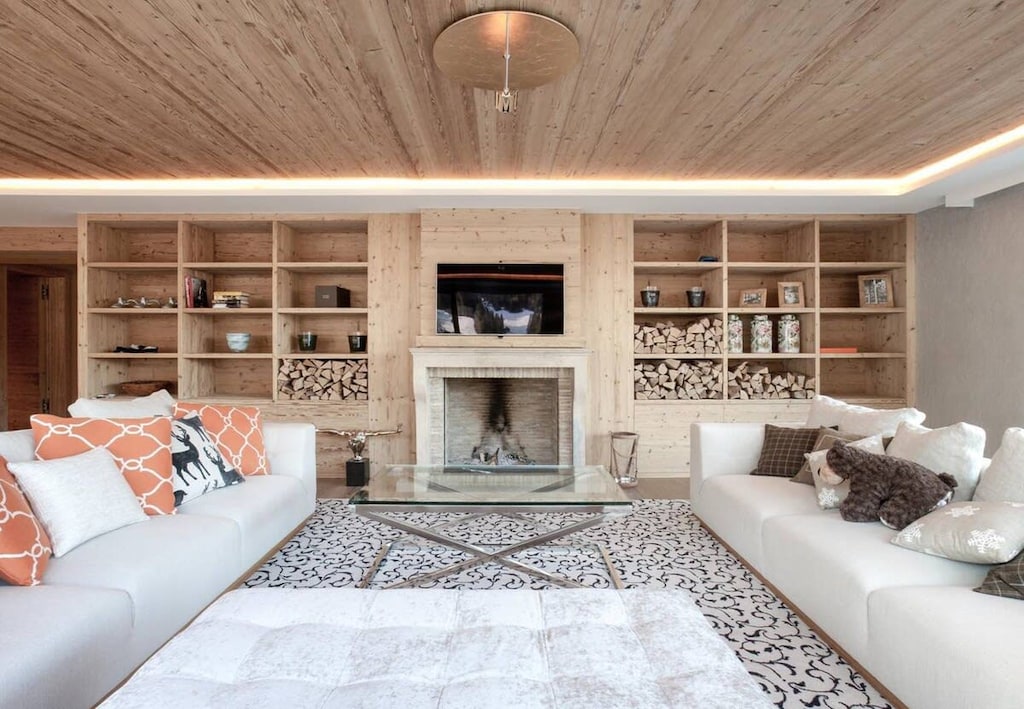 spacious living room sitting area infront of the tv 