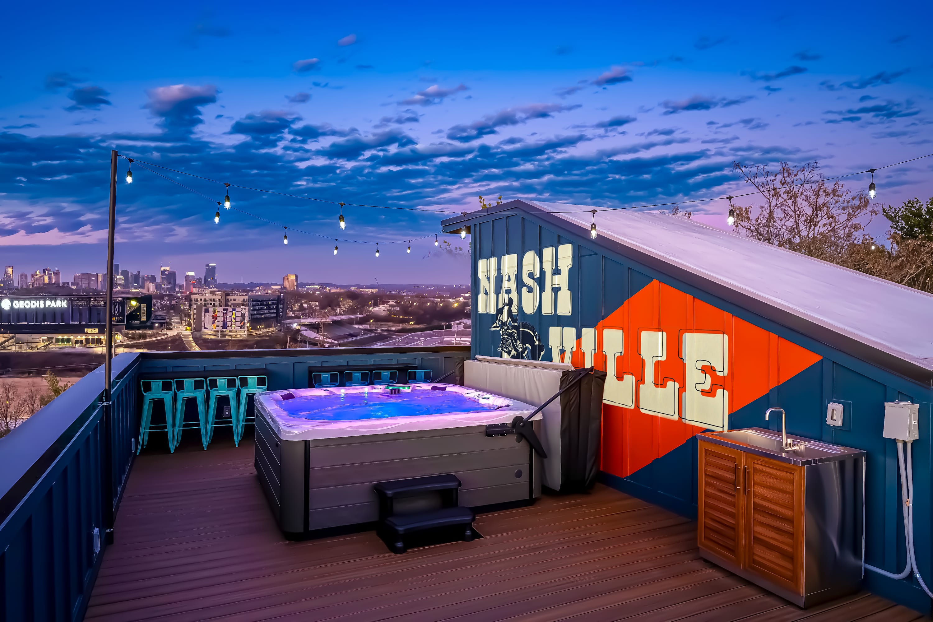 Enjoy breathtaking Nashville skyline views from your private rooftop oasis! Relax in the hot tub amid twinkling lights—perfect for a bachelorette party or chic corporate retreat. Experience Music City luxury!
